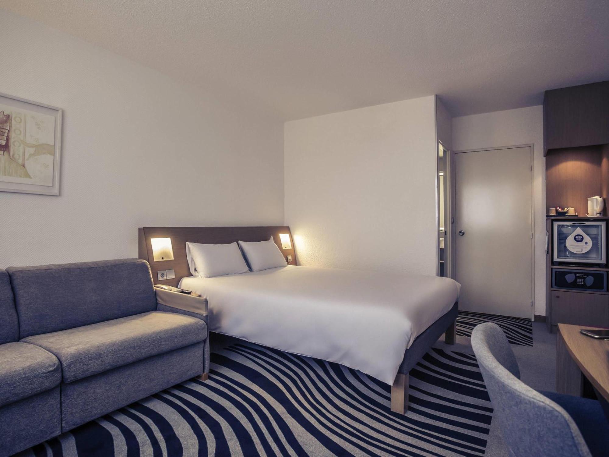 Chambre Exécutive avec Lit Queen-Size et Canapé